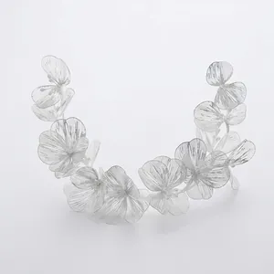 Elegant silver flower headband with pearls and textured petals for bridal hair styling