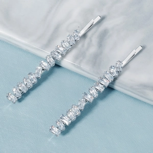 Macro detail of elegant silver alloy hairpins with sparkling rectangular zircon stones