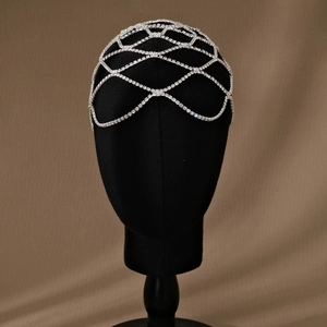 Exquisite silver rhinestone hair net headpiece shown on a mannequin head for gala events