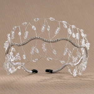 Detailed macro view of handcrafted silver wire headband with sparkling faceted crystals
