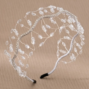 Detail of handmade woven silver wire headband with crystal beads and sparkling rhinestones