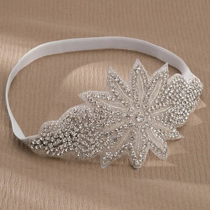 Sparkling rhinestone leaf bridal headband with handmade silver beads on elastic white band