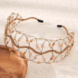 Detailed close-up of handmade bridal headband with amber crystal beads and mesh wire