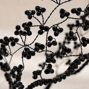 Macro detail of black crystal beaded bridal headband with hand-woven branch-like details