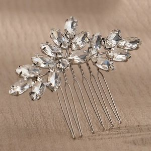 Detail view of marquise-cut crystal bridal hair comb with silver metal teeth for styling