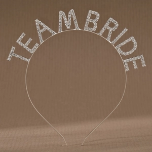 Detail of silver alloy headband with sparkling rhinestone Team Bride lettering for weddings