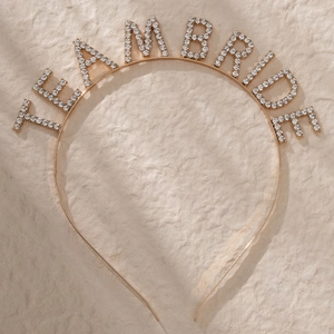 Detail shot of Team Bride rhinestone headband with gold metal base for party favors