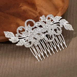 Macro detail of silver wedding hair comb with intricate floral rhinestones and alloy teeth