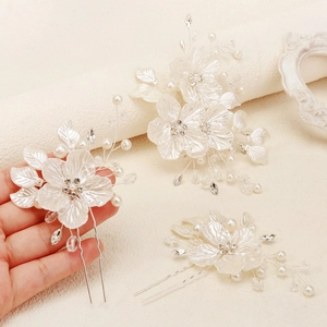Three-piece bridal hair pin set with white handmade beaded flowers and pearls