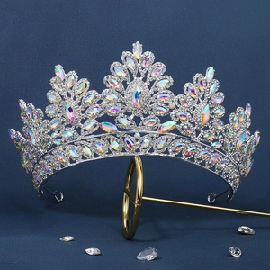 Sparkling silver bridal crown with colorful crystals on a navy background for wedding
