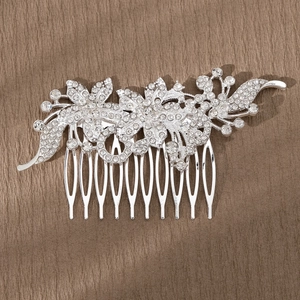 Detailed close-up of a silver bridal hair comb with alloy flowers and sparkling rhinestones