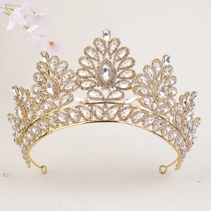 Macro view of gold bridal crown featuring intricate crystals and water drop rhinestones