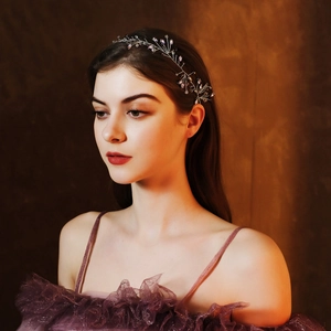 Detailed view of handmade purple crystal bridal headband with silver wire branches