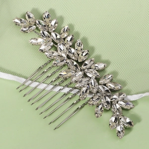 Detail of silver bridal hair comb featuring sparkly marquise cut crystal leaf clusters