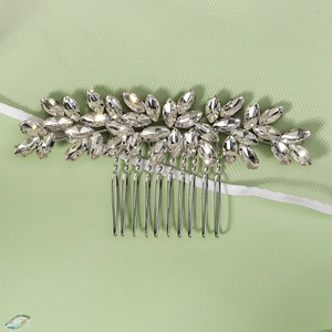 Close-up of luxury bridal hair comb with marquise crystals and silver leaf design