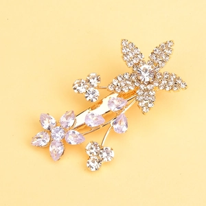 Eleganter Blumen-Haarclip mit lila Zirkon und weißen Kristallen auf Goldbasis