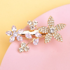 Elegant gold flower hair clip featuring purple zircon and white rhinestones for women
