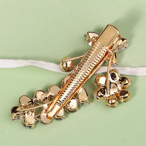 Elegant gold finish floral hair clip with zircon rhinestones and a spring duckbill clamp