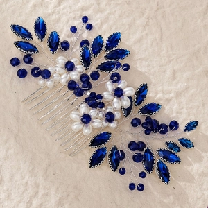 Elegant bridal hair comb with deep blue crystals and white pearls in a floral silver wire design