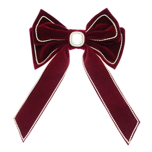 Classic red velvet bow hair clip with gold beaded edges and a square pearl center