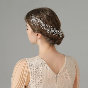 Macro detail of bridal hair comb with woven silver wire and sparkling crystal rhinestones