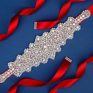 Elegant bridal wedding belt with sparkling crystals and rhinestones on deep red ribbon