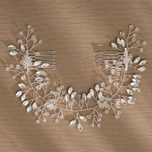 Detail of handcrafted bridal hair comb with silver wire weaving and sparkling crystals