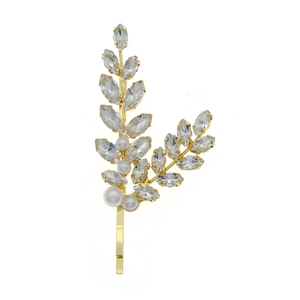 Golden wheat-shaped hair clip with sparkling rhinestones and white pearls on a white surface