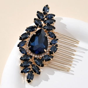 Detailed close-up of blue marquise crystal rhinestones on a gold bridal hair comb