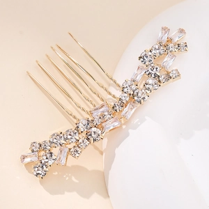 Elegant gold hair comb with double-row sparkling rhinestones and zircons on white stone