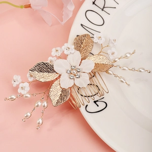 Handmade bridal hair comb with white fabric flowers, pearls, and gold alloy leaves