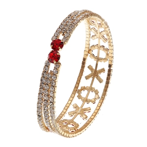 Bracelet extensible doré avec diamants blancs, pierres rouges et lettres XO