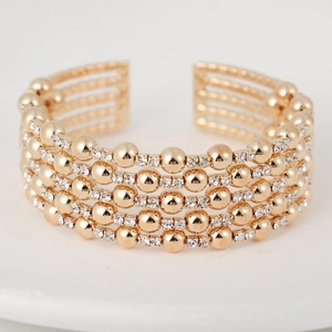 Elegant gold-plated multi-layer beaded open cuff bracelet with sparkling white rhinestones