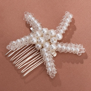 Detail view of handmade starfish hair comb with white pearls and clear crystal beads
