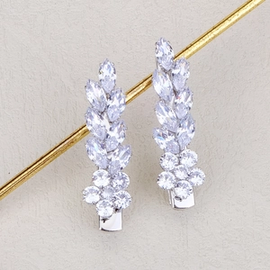 Detailed macro view of marquise and round cut zircon stones in a floral earring cluster