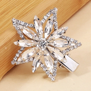 Close-up of snowflake hair clip with zircon marquise crystals on silver alloy base