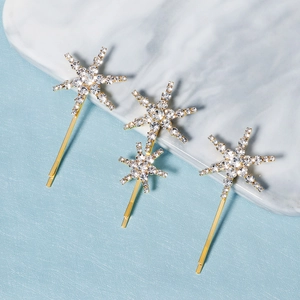 Elegant gold snowflake hair pins with white rhinestones set of four for women