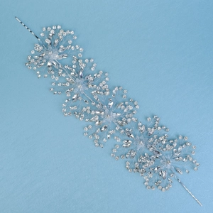 Detailed macro view of hand-woven bridal hair vine with sparkling crystals and rhinestones