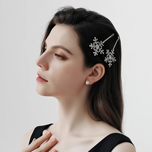 Detail view of vintage silver snowflake hair clips with luxury rhinestones on model