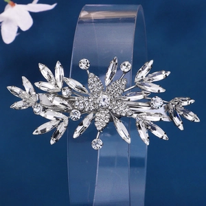Close-up of sparkling silver rhinestone flower hair clip with marquise zircons