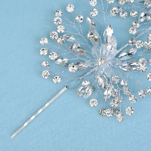 Detailed macro view of handcrafted silver bridal hair clip with crystals and rhinestones
