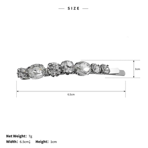 Detailed size specifications of a 6.5cm rhinestone hair clip with 7g net weight info