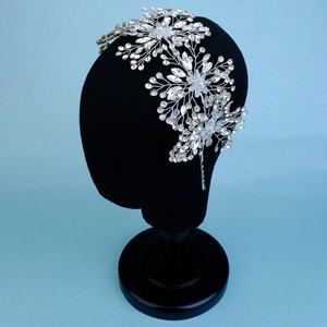 Detailed macro view of silver bridal headband with woven crystals and sparkly rhinestones