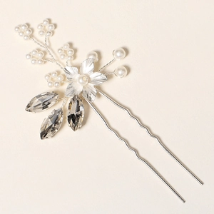 Elegant bridal hair pin with handcrafted pearls and sparkling crystal leaves for weddings