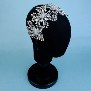 Detail of luxury bridal headband with snowflake silver crystals and rhinestone floral patterns