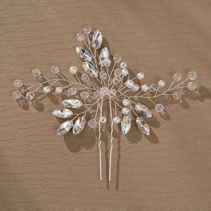 Handmade bridal hair pin with white pearls and sparkling crystals on a silver U-shaped clip
