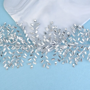 Detailed macro view of silver woven wire bridal headband with marquise rhinestones