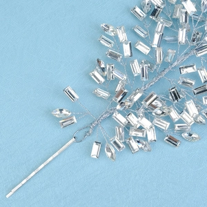 Detail shot of handcrafted silver bridal headband with luxury crystal and rhinestone branch