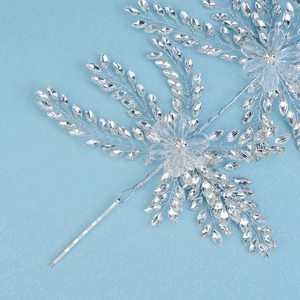 Detailed close-up of luxury bridal headband with woven crystals and silver wires