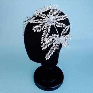 Detailed close-up of crystal bridal headband with marquise rhinestones and flower motifs